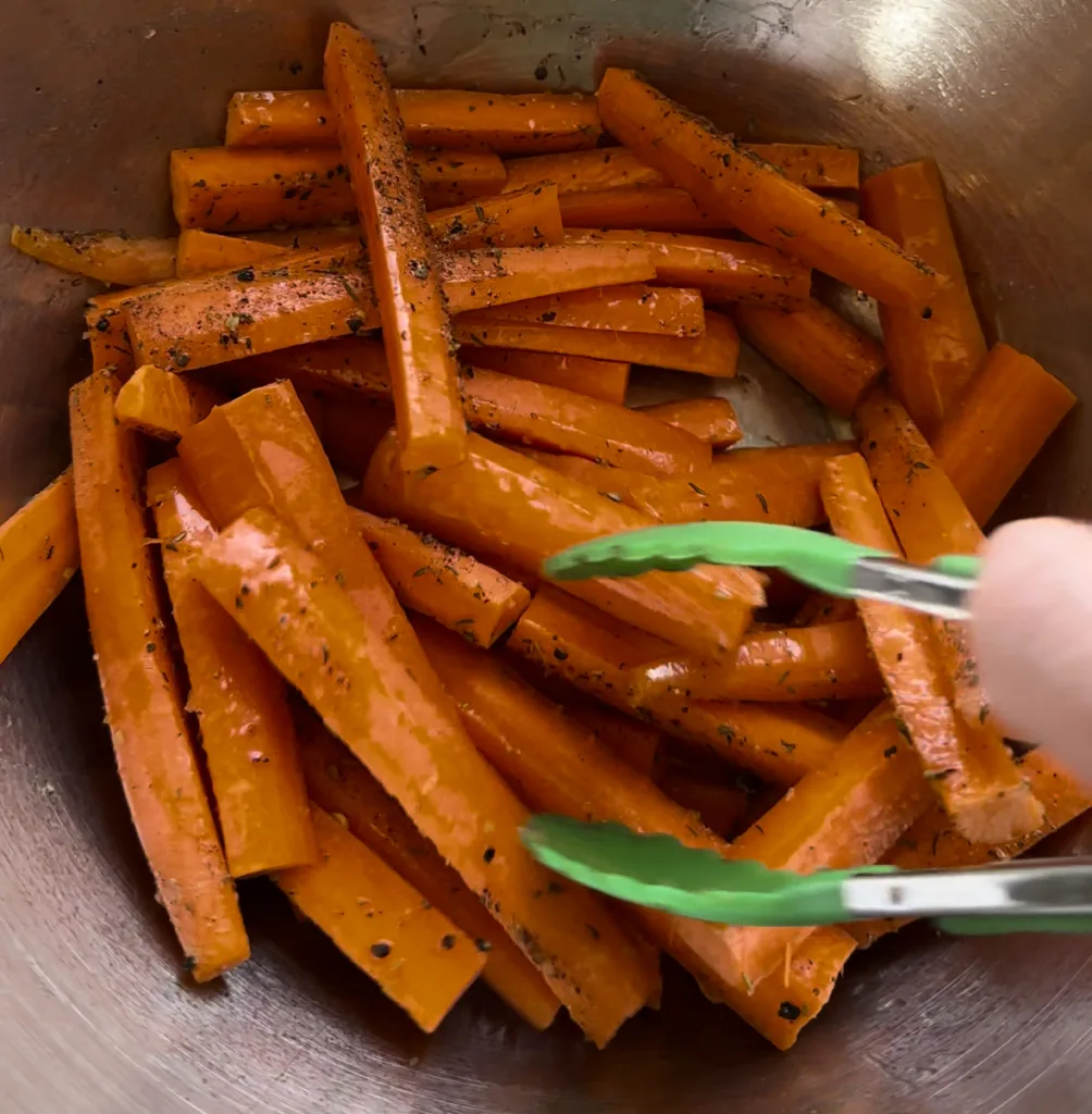 Mix carrots with EVOO and seasonings.