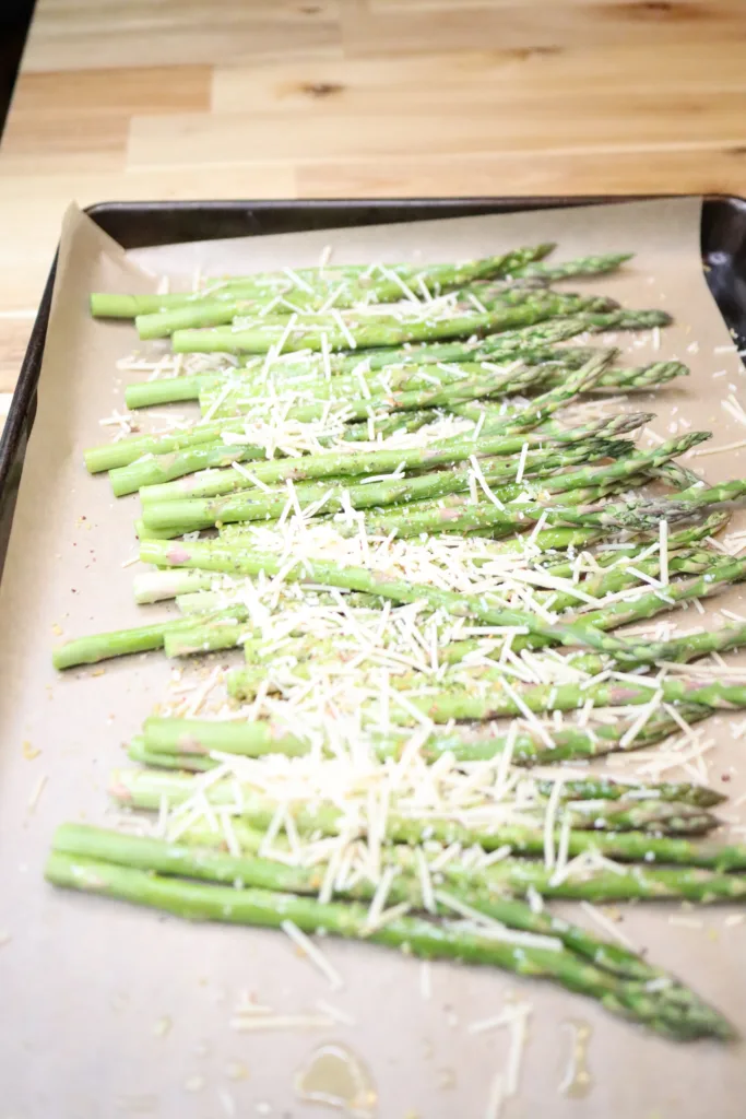 Spread on baking tray lined with parchment covered with seasonings and parmesan cheese.