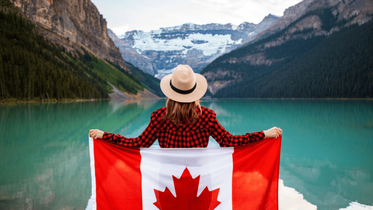 Moving to Canada from US: Woman holding Canadian Flag